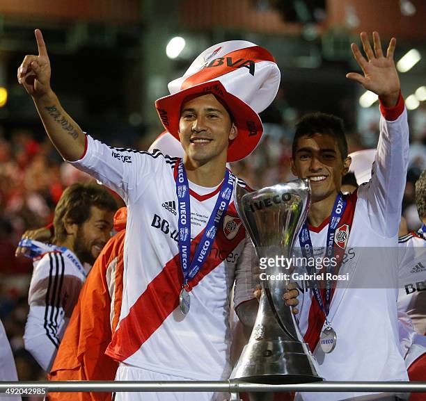 Jonathan Fabbro and Manuel Lanzini of River Plate celebrate at the end of Torneo Final 2014 after winning the match between River Plate and Quilmes...
