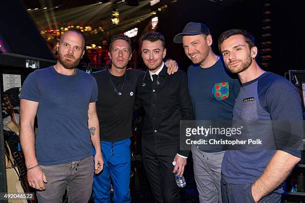 Singer Sam Smith poses with musicians Will Champion, Chris Martin, Jonny Buckland and Guy Berryman of Coldplay backstage at the 2015 iHeartRadio...