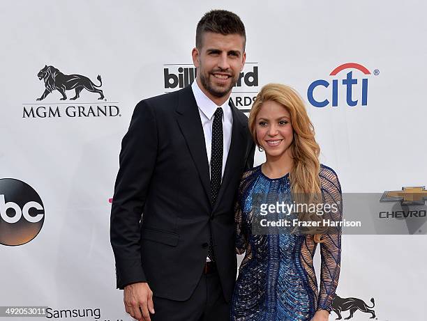 Singer Shakira and soccer player Gerard Pique attend the 2014 Billboard Music Awards at the MGM Grand Garden Arena on May 18, 2014 in Las Vegas,...