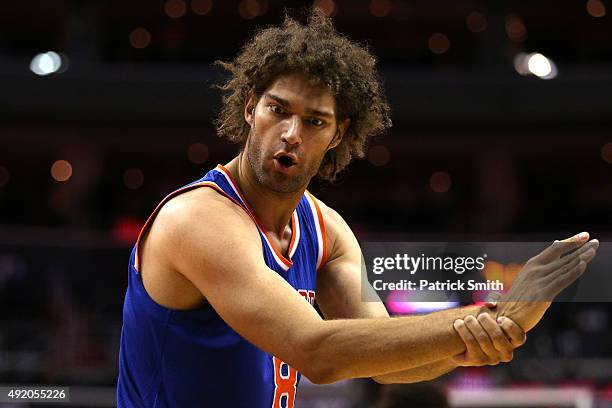 Robin Lopez of the New York Knicks gestures to the referee against the Washington Wizards during the first half at Verizon Center on October 9, 2015...