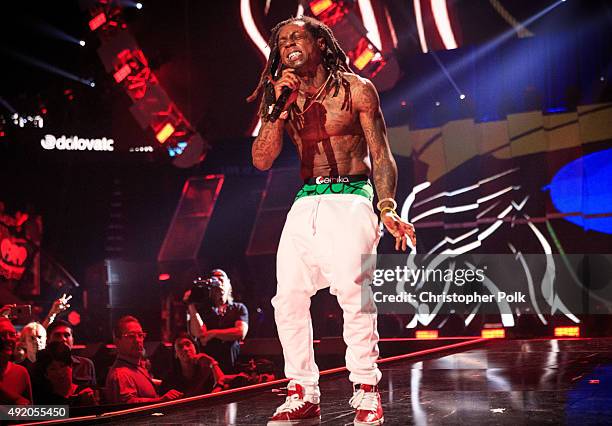 Rapper Lil' Wayne performs onstage at the 2015 iHeartRadio Music Festival at MGM Grand Garden Arena on September 18, 2015 in Las Vegas, Nevada.