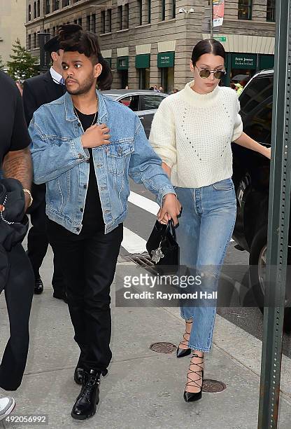 Model Bella Hadid and The Weeknd are seen walking in Soho on October 9, 2015 in New York City.