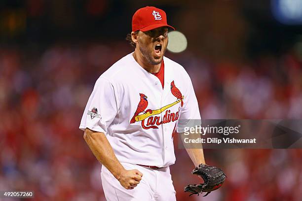 John Lackey of the St. Louis Cardinals celebrates after a double play in the seventh inning against the Chicago Cubs during game one of the National...