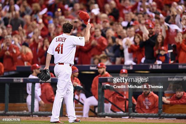 St. Louis Cardinals fans applaud as John Lackey of the St. Louis Cardinals walks off the field in the eighth inning against the Chicago Cubs during...