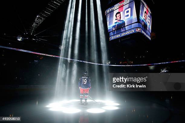 Ryan Johansen of the Columbus Blue Jackets is illuminated by spot lights while being introduced to the crowd prior to the start of the game against...
