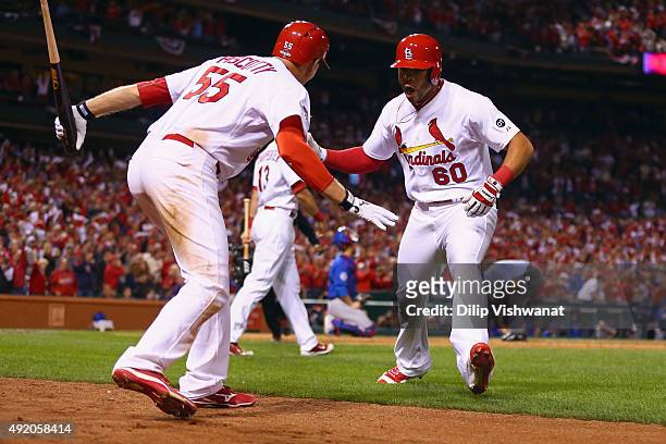 Thomas Pham of the St. Louis Cardinals celebrates with Stephen Piscotty of the St. Louis Cardinals after hitting a solo home run in the eighth inning...