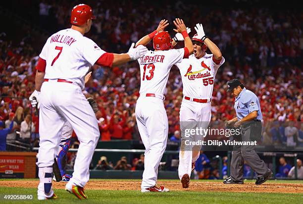 Stephen Piscotty of the St. Louis Cardinals celebrates with Matt Carpenter of the St. Louis Cardinals after hitting a two-run home run in the eighth...