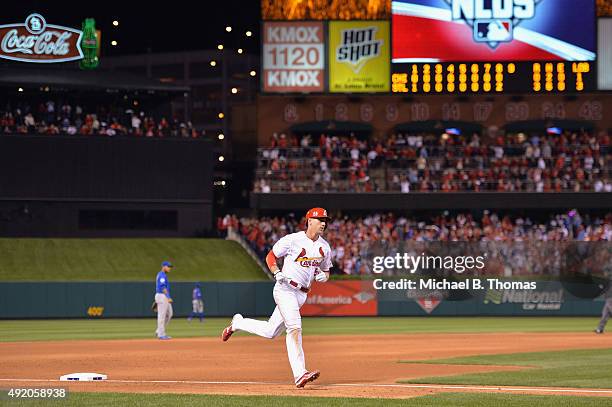 Stephen Piscotty of the St. Louis Cardinals runs the bases after hitting a two-run home run in the eighth inning against the Chicago Cubs during game...