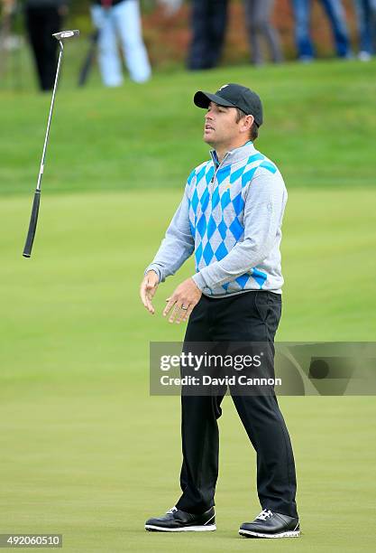 Louis Oosthuizen of South Africa and the International Team reacts as his putt for par misses on the sixth hole in his match with Branden Grace...