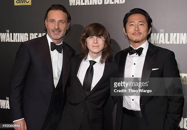 Actors Andrew Lincoln , Chandler Riggs, and Steven Yeun attend the season six premiere of "The Walking Dead" at Madison Square Garden on October 9,...