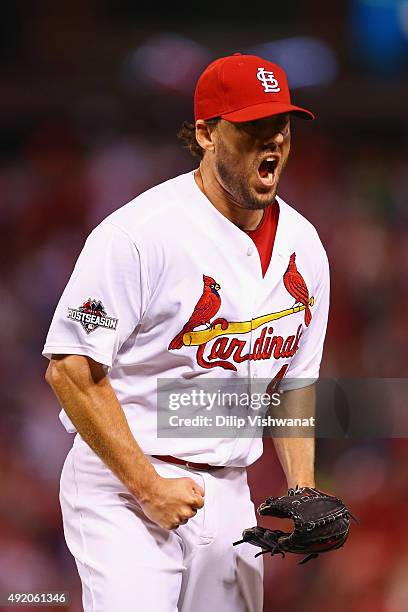 John Lackey of the St. Louis Cardinals celebrates after a double play in the seventh inning against the Chicago Cubs during game one of the National...