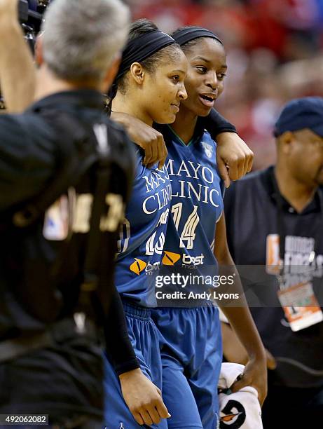 Maya Moore of the Minnesota Lynx celebrates with Devereaux Peters after making the game winning shot to beat the Indiana Fever 80-77 during Game...