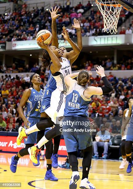 Tamika Catchings of the Indiana Fever shoots the ball against the Minnesota Lynx during Game Three of the 2015 WNBA Finals at Bankers Life Fieldhouse...