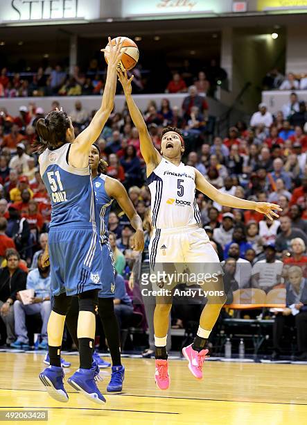 Anna Cruz of the Minnesota Lynx defends the shot of Layshia Clarendon of the Indiana Fever during Game Three of the 2015 WNBA Finals at Bankers Life...