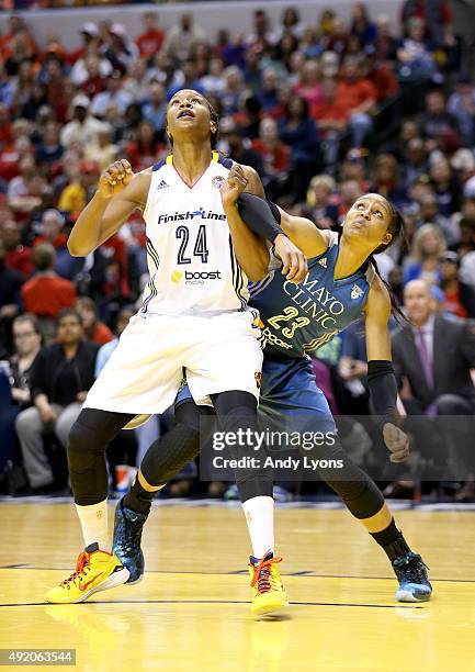 Tamika Catchings of the Indiana Fever and Maya Moore of the Minnesota Lynx battle for rebound position during Game Three of the 2015 WNBA Finals at...