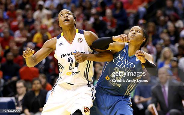 Tamika Catchings of the Indiana Fever and Maya Moore of the Minnesota Lynx battle for rebound position during Game Three of the 2015 WNBA Finals at...