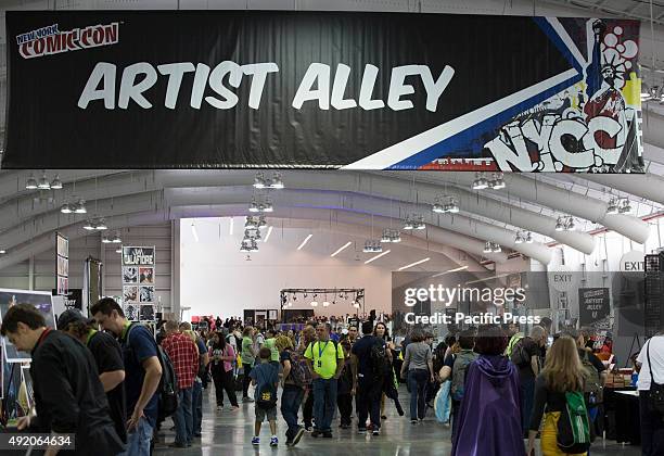 Fan poses in costume during the first day of New York Comic Con at The Jacob K. Javits Convention Center in New York City.