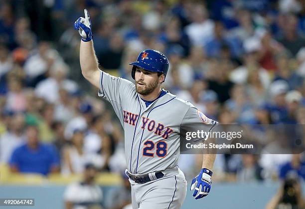 Daniel Murphy of the New York Mets reacts after he hits a solo home run in the fourth inning against the Los Angeles Dodgers in game one of the...