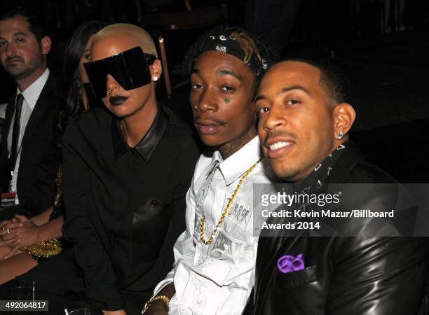 Model Amber Rose, rapper Wiz Khalifa and host Chris 'Ludacris' Bridges pose during the 2014 Billboard Music Awards at the MGM Grand Garden Arena on...