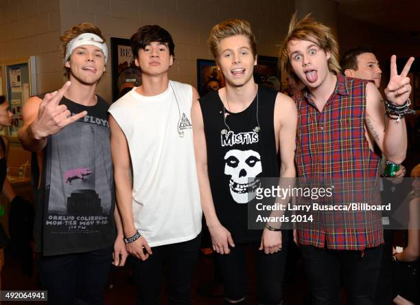 Recording artists Ashton Irwin, Calum Hood, Luke Hemmings and Michael Clifford of 5 Seconds of Summer attend the 2014 Billboard Music Awards at the...