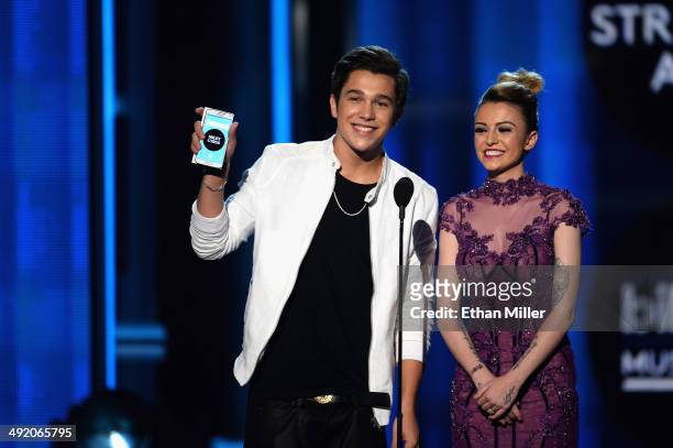 Recording artists Austin Mahone and Cher Lloyd speak onstage during the 2014 Billboard Music Awards at the MGM Grand Garden Arena on May 18, 2014 in...