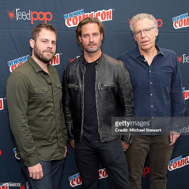 Producer Ryan Condal, actor Josh Holloway and producer Carlton Cuse pose in the press room for the "Colony" panel during New York Comic-Con Day 2 at...