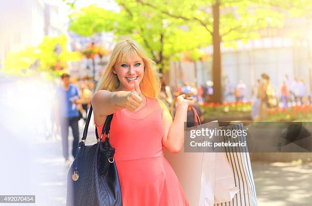 shopping woman with thumbs up - knez mihailova street stock pictures, royalty-free photos & images