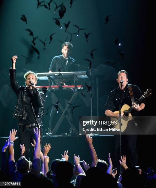 Singer Ryan Tedder and guitarist Zach Filkins of OneRepublic perform onstage during the 2014 Billboard Music Awards at the MGM Grand Garden Arena on...