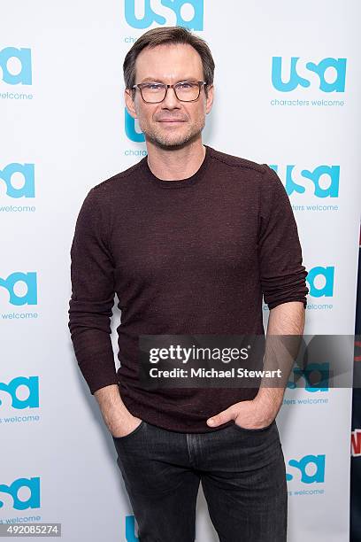 Actor Christian Slater poses in the press room for the "Mr. Robot" panel during New York Comic-Con Day 2 at The Jacob K. Javits Convention Center on...