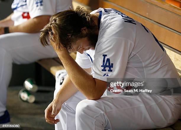 Clayton Kershaw of the Los Angeles Dodgers reacts in the dugout after being taken out of the game in the seventh inning against the New York Mets in...