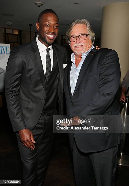 Dwyane Wade and Micky Arison are seen at Ocean Drive Magazine's October Men's Issue celebration at StripSteak by Michael Mina at the Fontainebleau on...