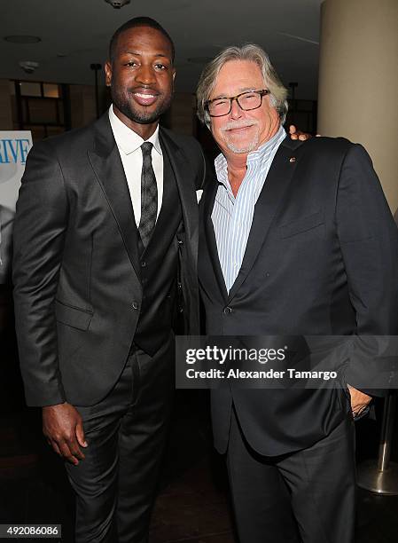 Dwyane Wade and Micky Arison are seen at Ocean Drive Magazine's October Men's Issue celebration at StripSteak by Michael Mina at the Fontainebleau on...
