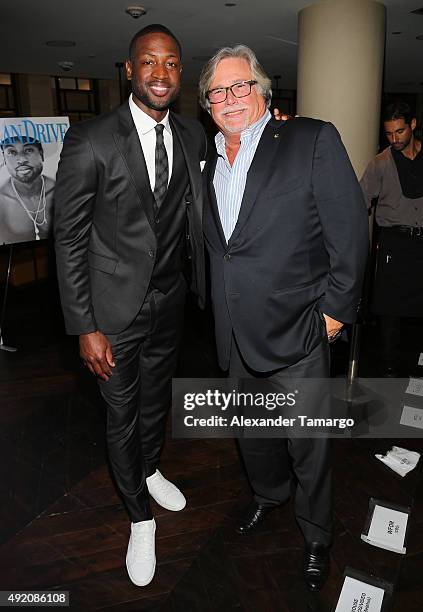 Dwyane Wade and Micky Arison are seen at Ocean Drive Magazine's October Men's Issue celebration at StripSteak by Michael Mina at the Fontainebleau on...