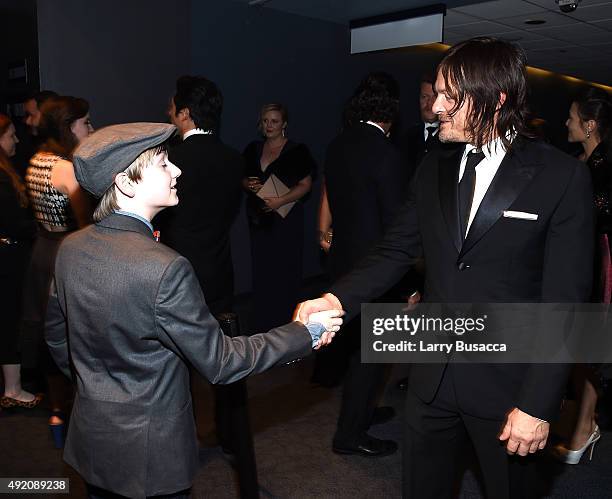 Major Dodson and Norman Reedus attend AMC's "The Walking Dead" Season 6 Fan Premiere Event 2015 at Madison Square Garden on October 9, 2015 in New...