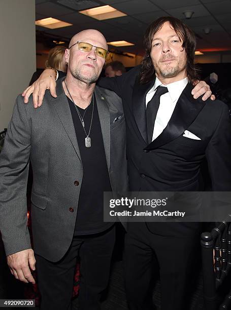 Actors Michael Rooker and Norman Reedus attend the AMC's "The Walking Dead" Season 6 Fan Premiere Event 2015 at Madison Square Garden on October 9,...
