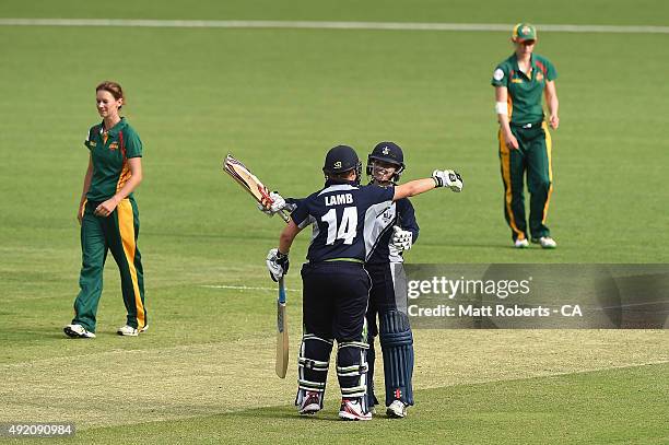 Kirsty Lamb and Kristen Beams of the Spirit celebrate during the round one WNCL match between Victoria and Tasmania at Allan Border Field on October...