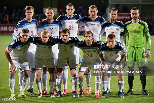 Russia's midfielder Aleksandr Kokorin, defender Sergei Ignashevich, forward Artyom Dzyuba, defender Aleksei Berezutski, midfielder and captain Roman...
