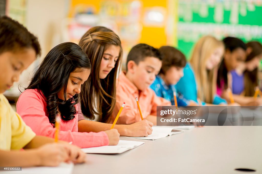 Row of Children Working on an Assignment