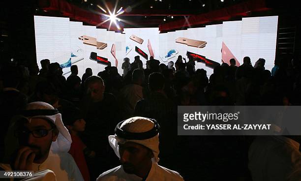 Kuwaitis attend the launch ceremony of the brand new apple iPhone 6s and iPhone 6s Plus smart-phones in front of Ooredoo Kuwait's headquarters in...