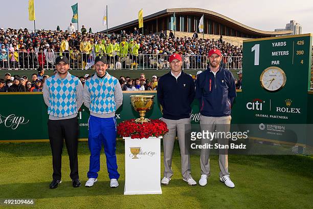 International Team players Jason Day of Australia and Charl Schwartzel of South Africa along with Team USA players Jordan Spieth and Dustin Johnson...
