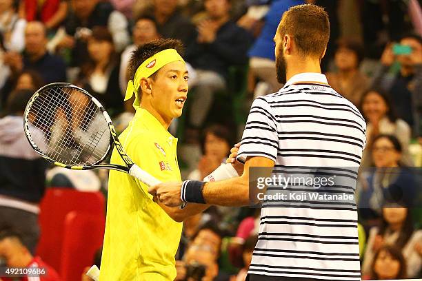 Benoit Paire of France shakes hands with Kei Nishikori of Japan after winning the men's singles semi final match on Day Six of the Rakuten Open 2015...