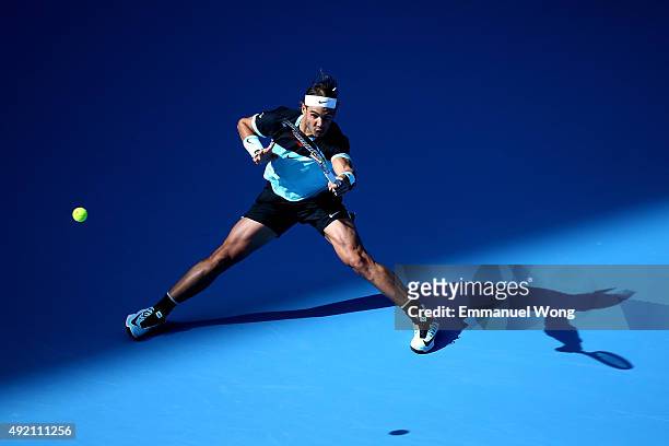 Rafael Nadal of Spain returns a ball against Fabio Fognini of Italy during the man's single semi-final of the 2015 China Open at the China National...