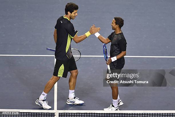 Raven Klaasen of South Africa and Marcelo Melo of Brazil celebrate after winning the men's doubles semi final match against Aisam-Ul-Haq Qureshi of...