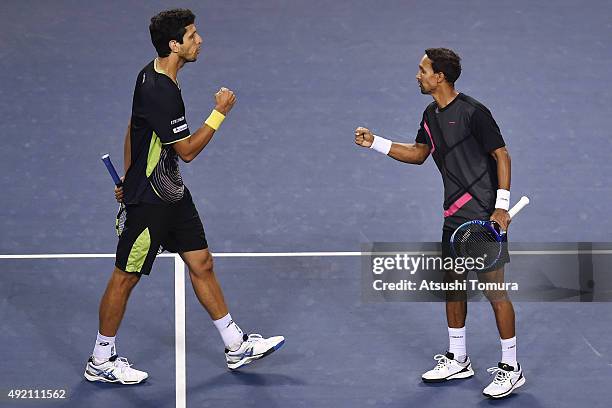 Raven Klaasen of South Africa and Marcelo Melo of Brazil celebrate after winning the men's doubles semi final match against Aisam-Ul-Haq Qureshi of...