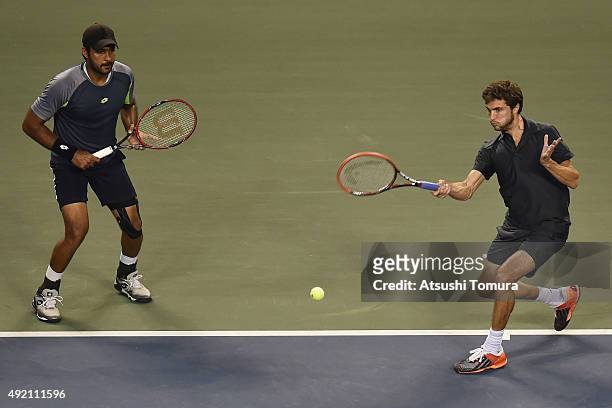 Aisam-Ul-Haq Qureshi of Pakistan and Gilles Simon of France compete against Raven Klaasen of South Africa and Marcelo Melo of Brazil during the men's...