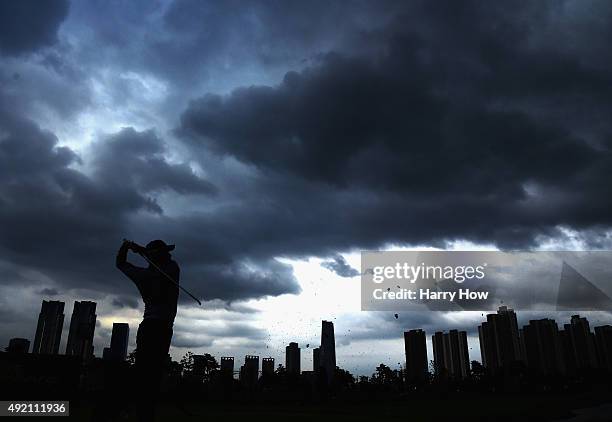 Hideki Matsuyama of the International Team hits a tee shot on the 13th hole during the Saturday four-ball matches at The Presidents Cup at Jack...