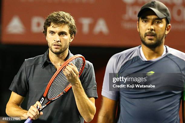 Aisam-Ul-Haq Qureshi of Pakistan and Gilles Simon of France compete against Raven Klaasen of South Africa and Marcelo Melo of Brazil during the men's...