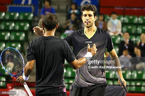 Raven Klaasen of South Africa and Marcelo Melo of Brazil celebrate after winning the men's doubles semi final match against Aisam-Ul-Haq Qureshi of...