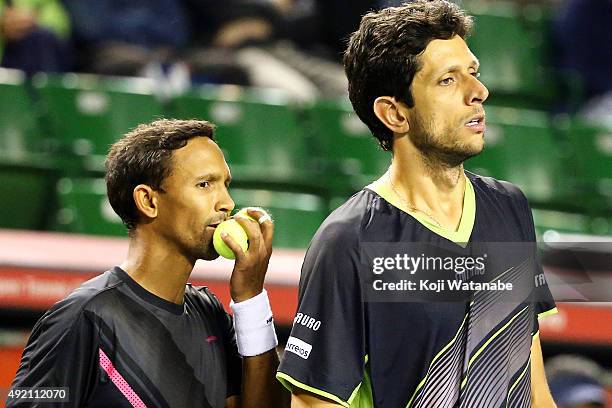 Raven Klaasen of South Africa and Marcelo Melo of Brazil compete against Aisam-Ul-Haq Qureshi of Pakistan and Gilles Simon of France during the men's...