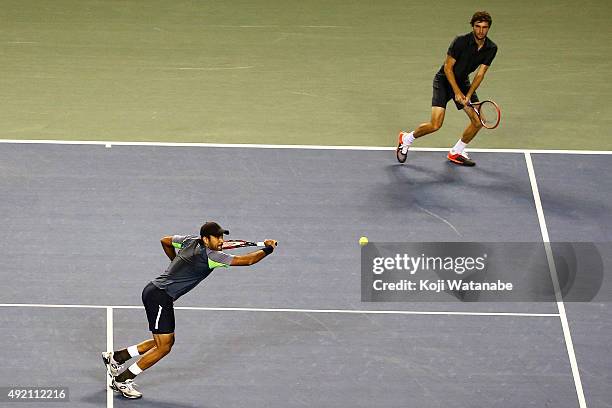 Aisam-Ul-Haq Qureshi of Pakistan and Gilles Simon of France compete against Raven Klaasen of South Africa and Marcelo Melo of Brazil during the men's...